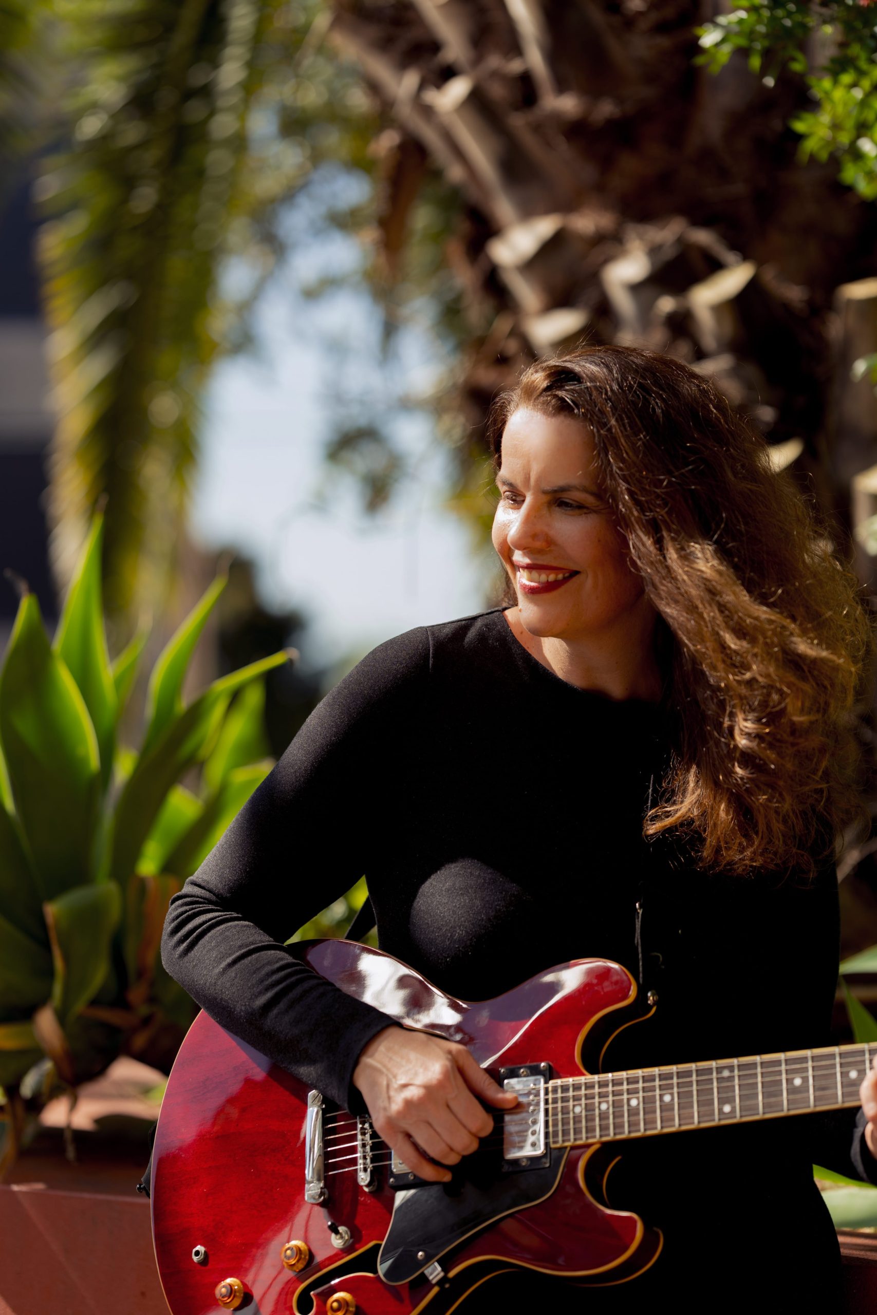 Cassandra Oscar playing guitar